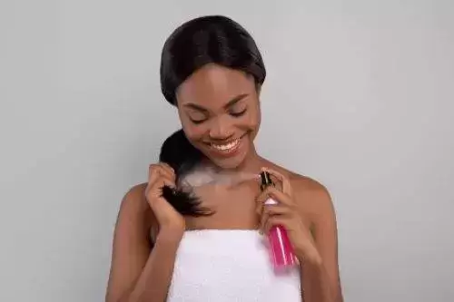 Black female using chemical hair straightening products