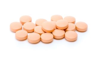 picture of a pile of orange pills