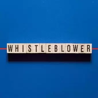 whistelblower spelled out in blocks on blue background