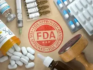 FDA red stamp on table by by pills