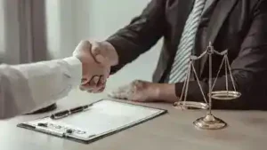 Nashville emergency vehicle accident lawyer shakes hand with client involved in an emergency vehicle accidents