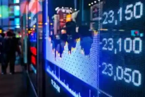 Display of Stock market quotes with city scene reflect on glass used illustratively in Manhattan Associates Class Action Lawsuit