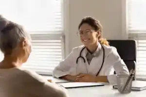 women involved in a Nashville Auto Accident talks to here doctor about the need to hire a Nashville auto accident attorney