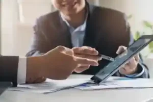 Car accident lawyer in Tennessee going over notes with client involved in a Tennessee car accident