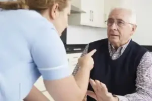 older male in nursing home being yelled at and pointed to in face by staff member