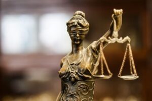lady justice justice is blind to the love of profit