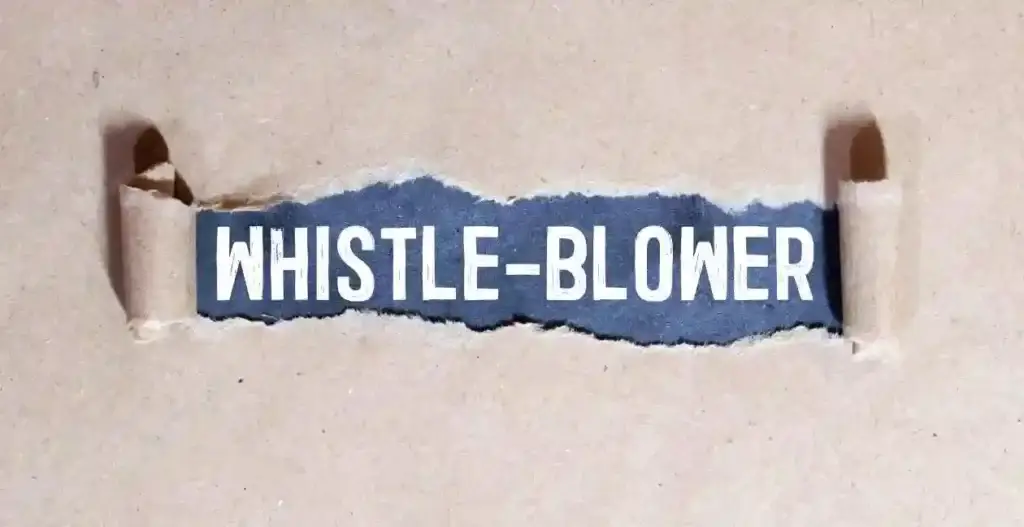 Whistleblower on white torn paper. used in Nashville Whistleblower Lawyer