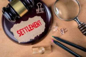 Settlement in red next to hammer and gavel