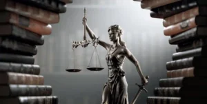 Lady justice holding scales in gold