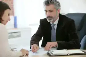 Murfreesboro Social Security Disability Lawyer meets with female client about social security benefits while going over notes