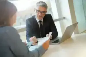 Murfreesboro Social Security Disability Lawyer meets with female client about social security benefits while going over notes
