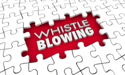 whistle blowing in white on red background in jig saw puzzle used in investor resources