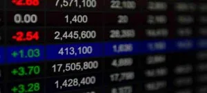 black stock ticker in 3d with white foreground numbers used in Hims & Hers Lawsuit