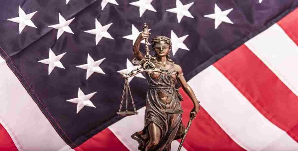 lady justice in front of American flag used in Sarepta Lawsuit