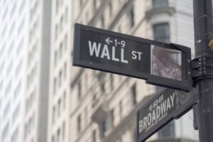 1980s picture of wall street sigh in NY city used in Compass Elevance Health Class Action Lawsuit