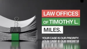 law offices of timothy l. miles next to stack of paper used in Open Lending lawsuit.