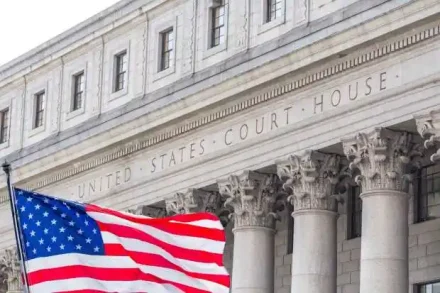 USA national flag waving in the wind in front of United States Court House in New York used in corporate governance