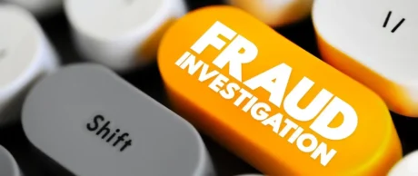 fraud investigation in white on orange keyboard button used in Fortinet class action lawsuit