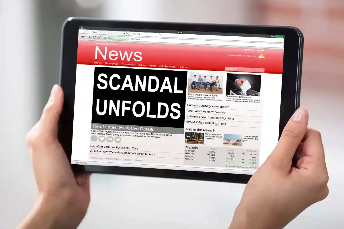 Hands Holding A Digital Table With A Screen Showing Unfolds Scandal News used in Misstating Asset Values in Financial Reporting What Is an Accounting Misstatement?