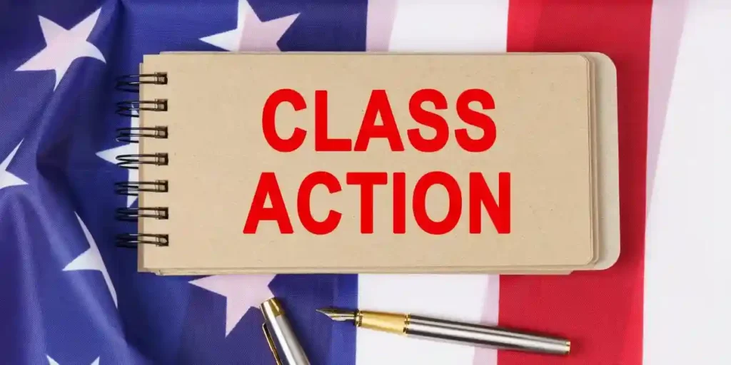 Class action on brown paper in front of american flag and used in pleading a strong inference of scienter