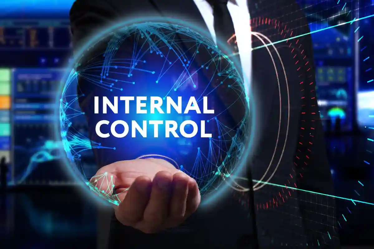 Business, Technology, Internet and network concept. Young businessman working in the field of the future, he sees the inscription: internal control used in Improper Financial Reporting