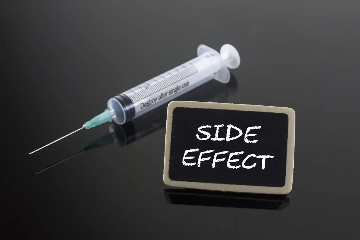 Medical Concept: Side Effect with syringe on blackboard used in Who Is Eligible for a Dupixent Cancer Lawsuit