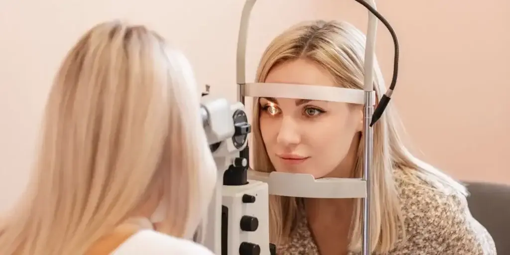 female getting eye exam from female doctor used in zepboud and vision loss