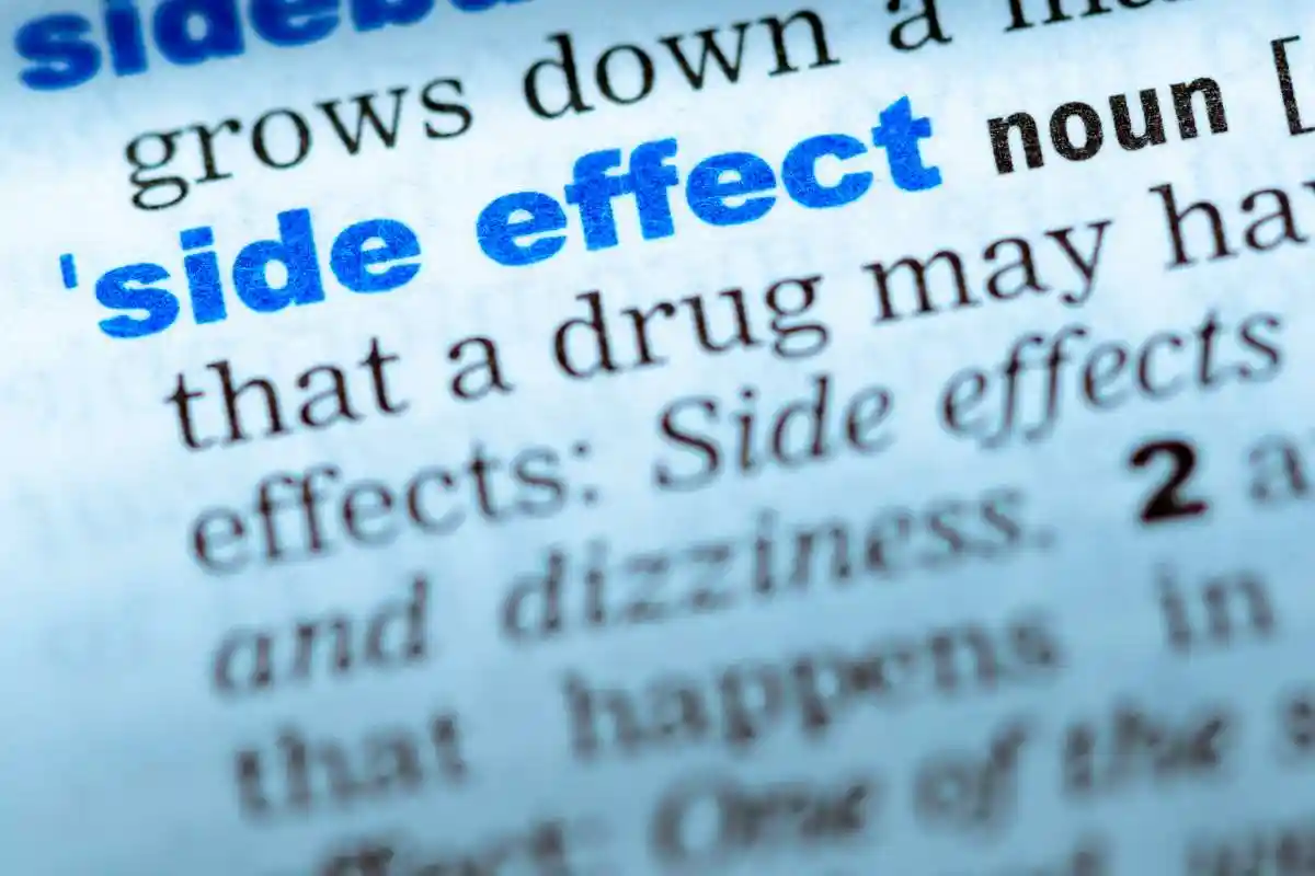 Close-up of word in English dictionary. Side effect, definition and transcription used in Zepbound Vision Loss Lawsuit 