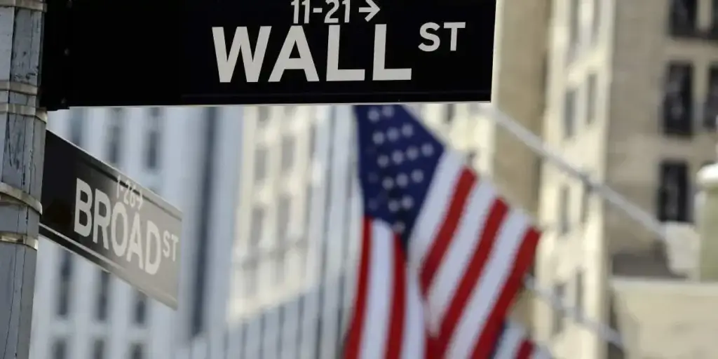 Wall street sign with American flag waving in background in securities litigation