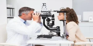 young femiale getting an eye examinaton from doctor in Mounjaro and Vison Loss
