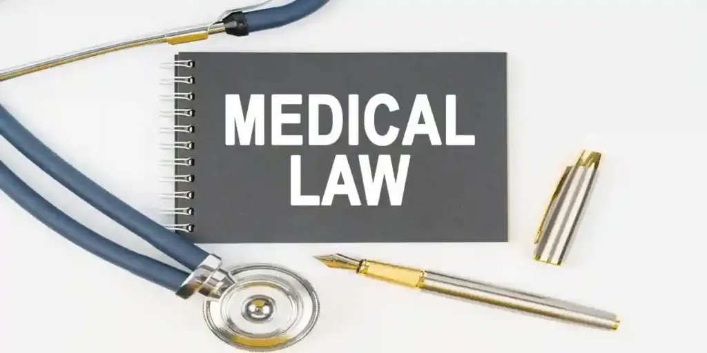 Medicine and health. On a white background lie a stethoscope, a pen and a notebook with the inscription - MEDICAL LAW Depo-Dupixent Cancer Lawsuit
