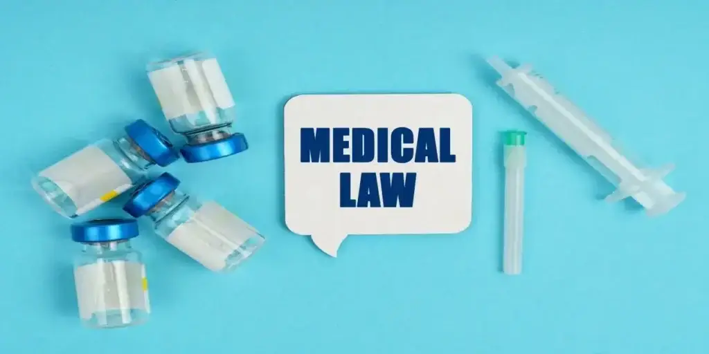 words "medical law" in blue on white background next to medical equipment all on light teel background image in eligible for a Mounjaro Stomach Paralysis Lawsuit,