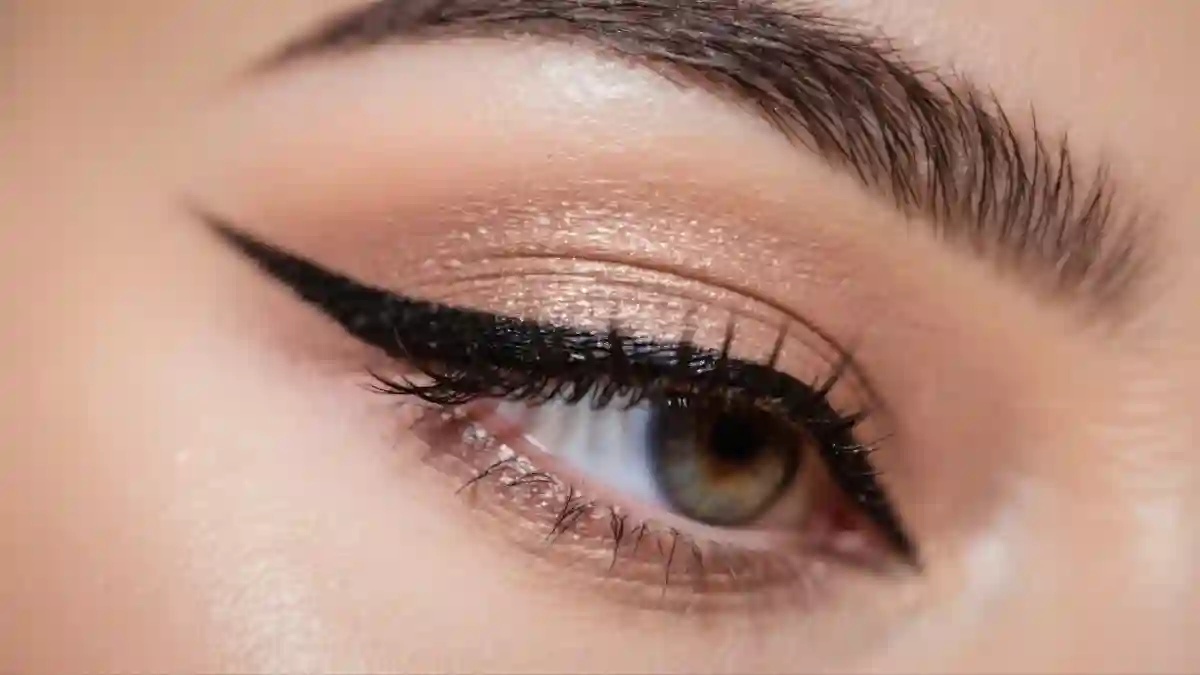 Close-up view of a beautifully made-up eye, featuring a sharp winged eyeliner, eyeshadow, and defined lashes, all enhanced. used in mounjaro vision loss lawsuit