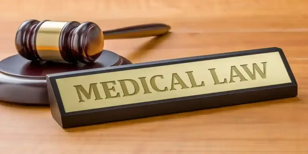 A gavel and a name plate with the engraving Medical law used as feature image in Zepbound and Blurry Vision, Zepbound Vision Problems, Zepbound and Vision Loss, Mounjaro Eye Problems
