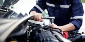 Mechanic are using the wrench to repair and maintenance auto engine at car repair shop,Car auto services and maintenance check concept. Used inGM Transmission Lawyer