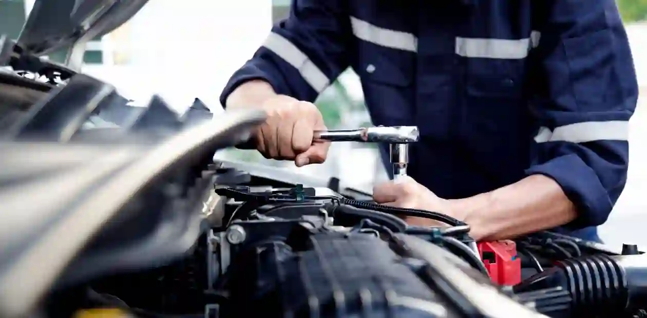 Mechanic are using the wrench to repair and maintenance auto engine at car repair shop,Car auto services and maintenance check concept. Used in Defective GM Transmission