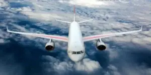 white passenger jet flying above clouds used in Toxic Fume Exposure