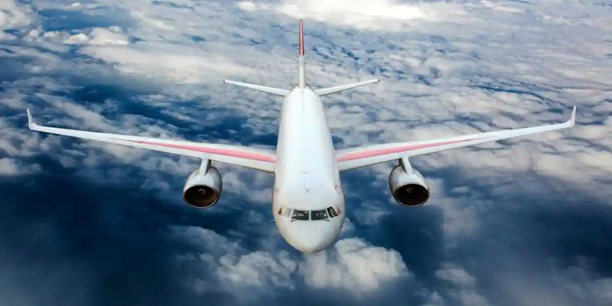 white passenger jet flying above clouds used in Toxic Fume Exposure