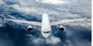 Passenger airplane in midflight, flying over clouds in day, used in fume even lawsuits