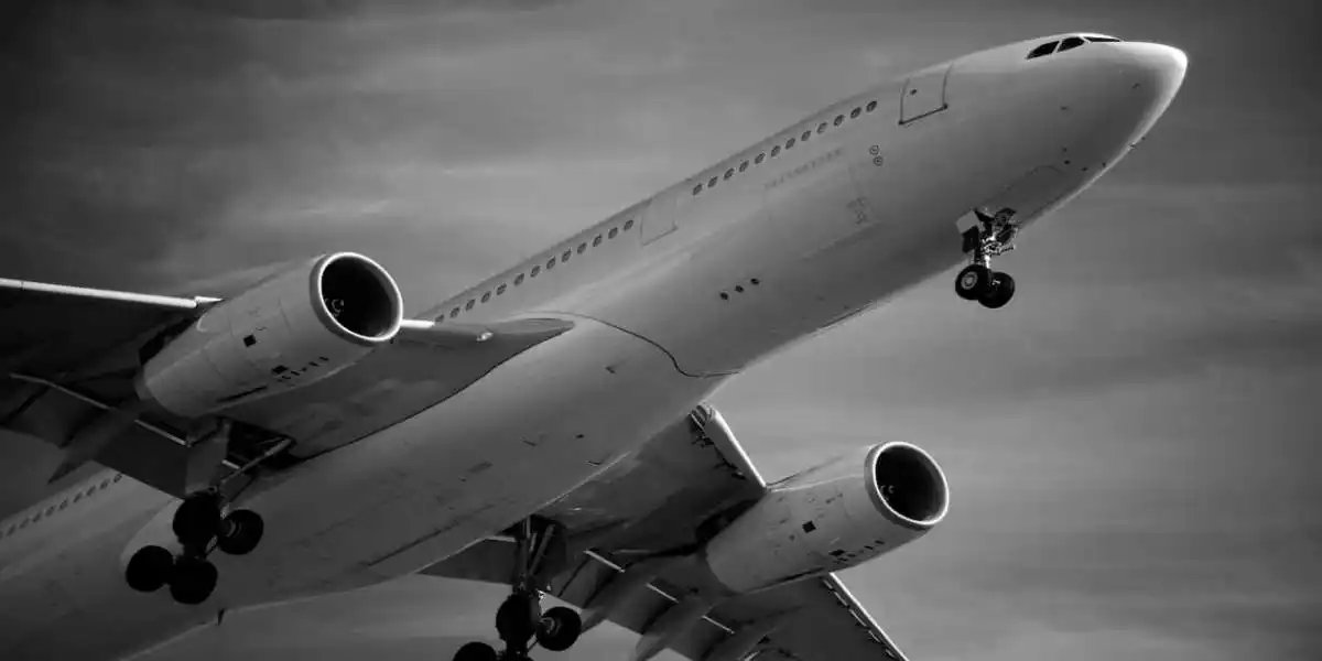 passenger airliner flying in a dark clloudy storm used in Toxic Airplane Cabin Fumes