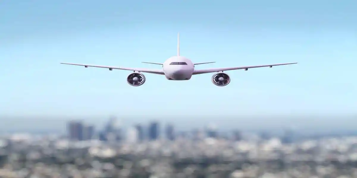 Airplane in the sky no clouds used in Eligible for a fume event lawsuits