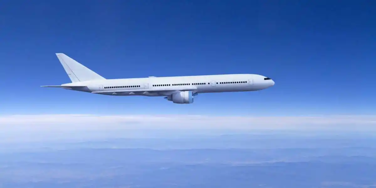 Passenger airplane flying above clouds
