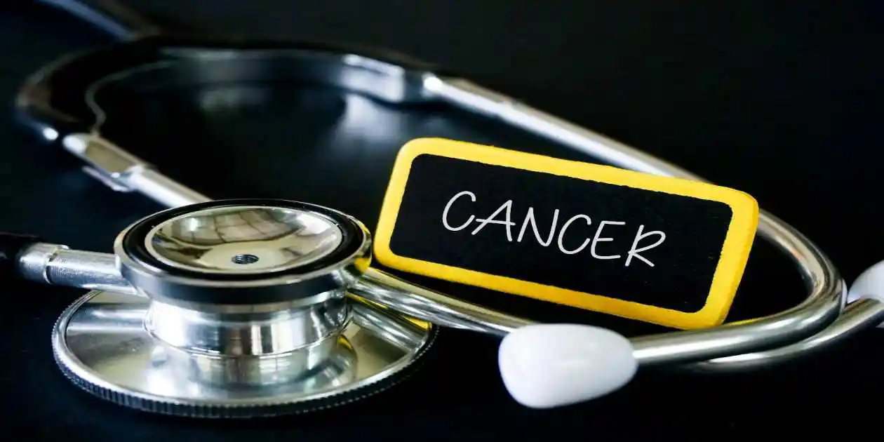 cancer wrote with chalk on charkboard next to stethoscope used in Criteria for a Silicosis Lawsuit,