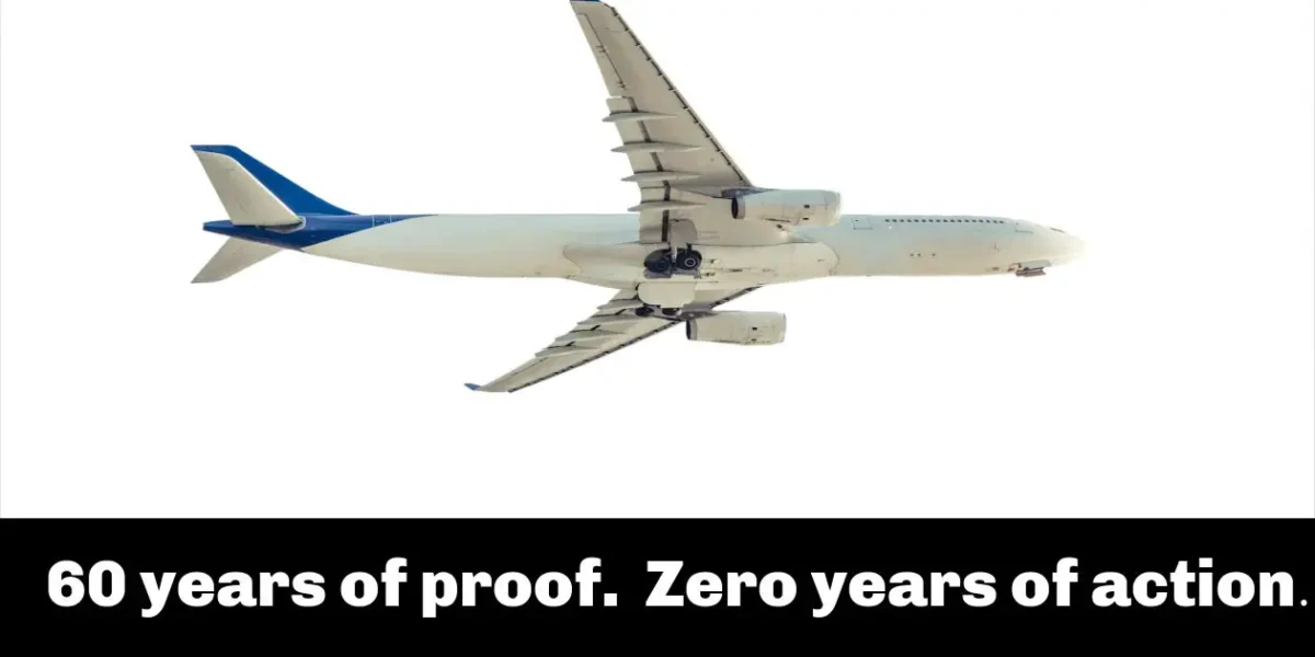 large white passenge plane flying in mid-air on sunny day used in exposure to toxic plane fumes