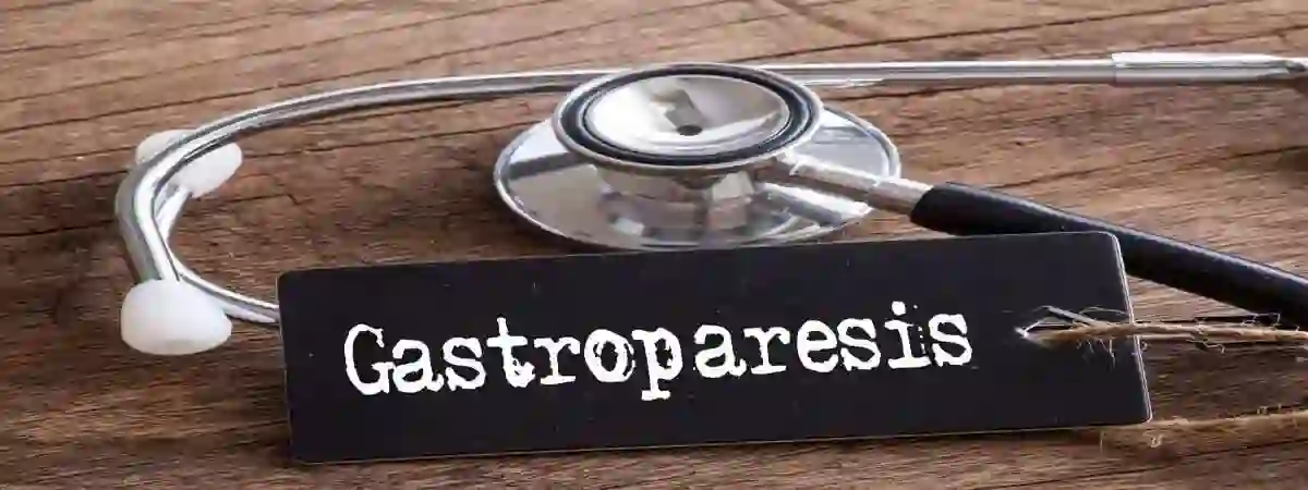 gastroparesis in white on black background next to stethoscope use in Mounjaro Stomach Paralysis Lawsuit