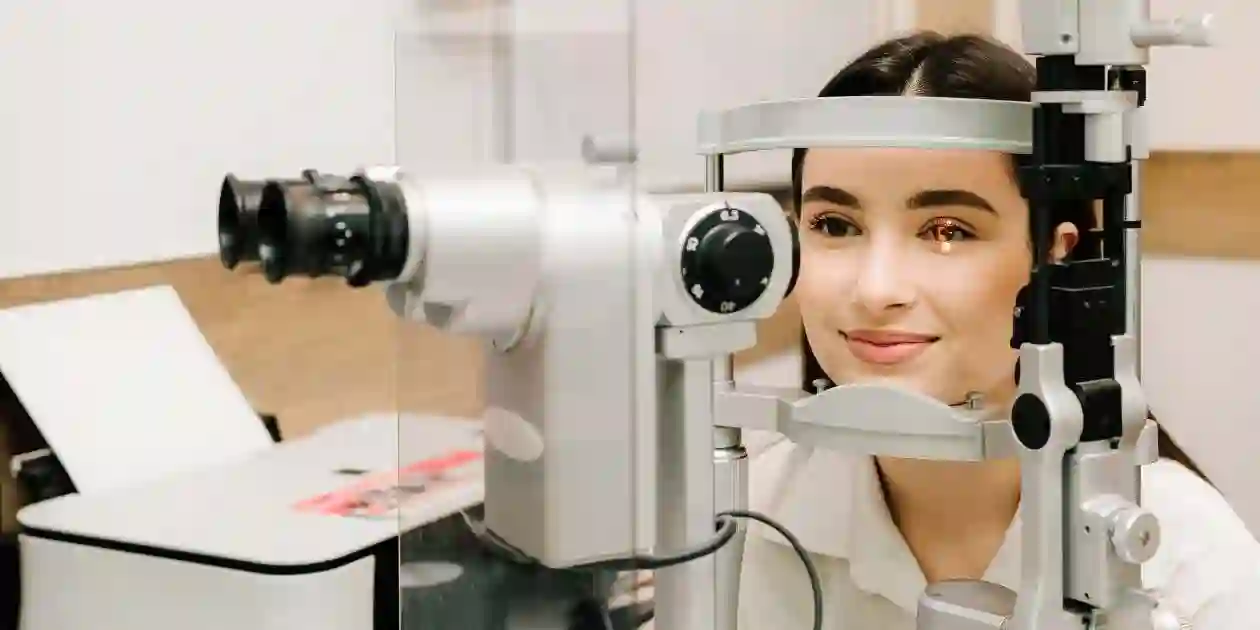 Ophthalmologist with slit lamp examines eyes and cornea of woman. Ophthalmologist illuminates eye of patient with light from slit lamp to diagnose the eyes and cornea and used in Zepbound and Blurry Vision