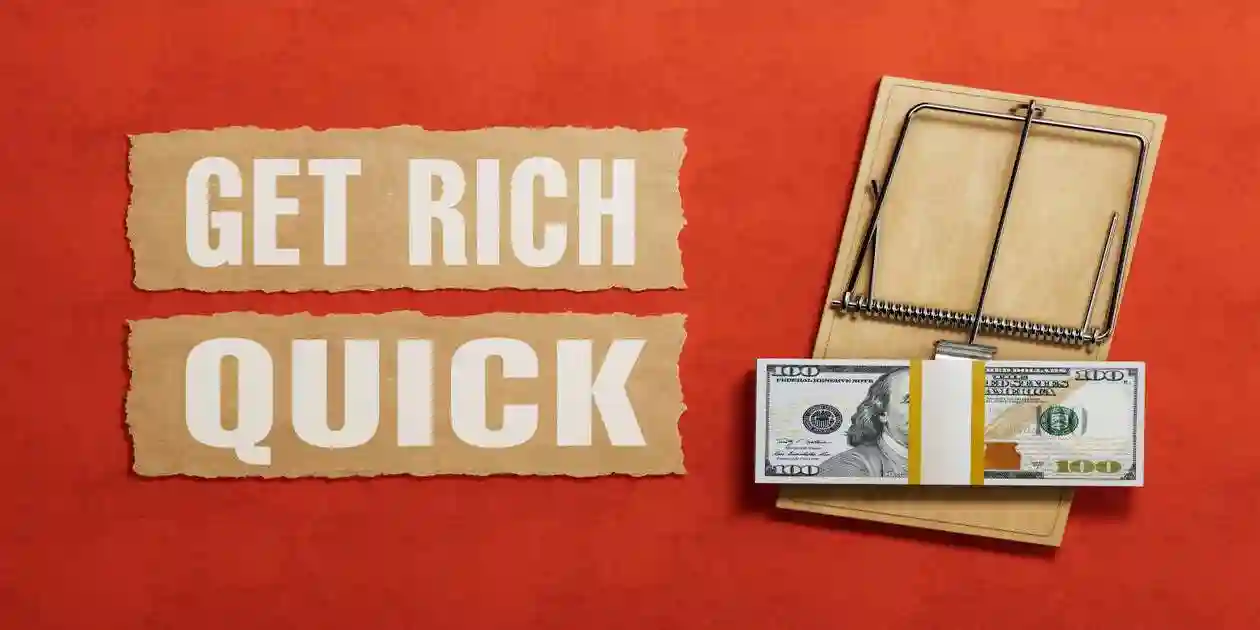 Financial Scam Concept. Mouse Trap With Dollar Bills Next To Get Rich Quick Text On Red Background. 3d Rendering