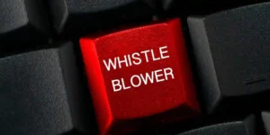 Whistleblowing concept: Black keyboard with a red key and the whistleblower word used in Whistleblower Lawsuit in Nashville