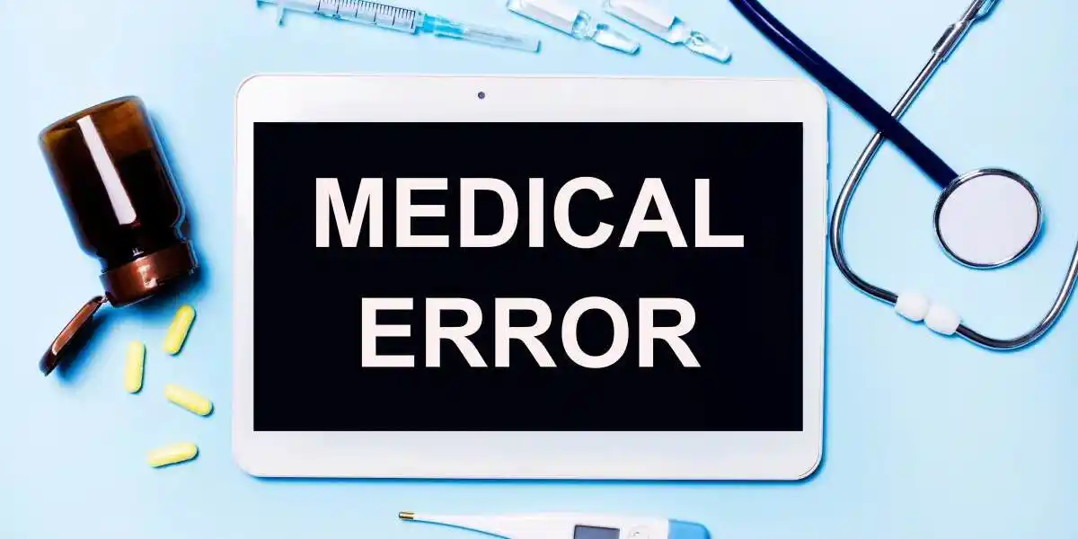Ampoules, pills, stethoscope, thermometer, tablet with MEDICAL ERROR text on desktop. Medical diagnosis or doctor's prescription mockup. Medicine concept used in Pharmacy Medication Error Lawyer in Tennessee