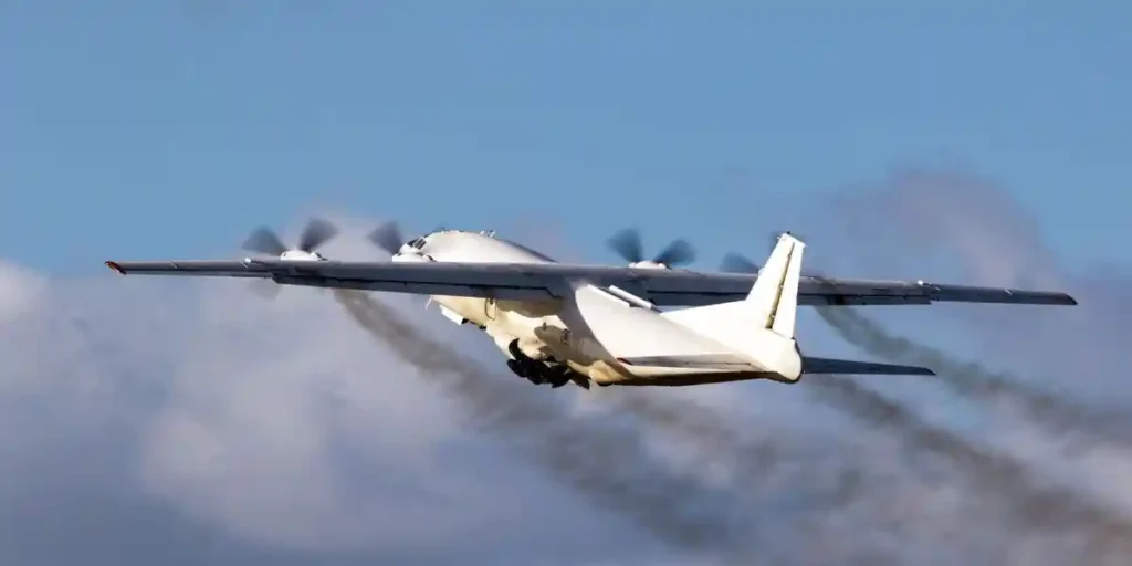 Old cargo airplane taking off with turboprop engine smoke emission. used in aerotoxic syndrome lawsuit